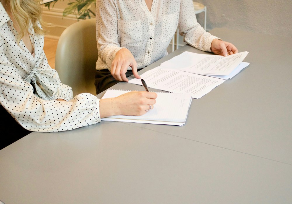 Parent reviewing an individualised education plan with a teacher