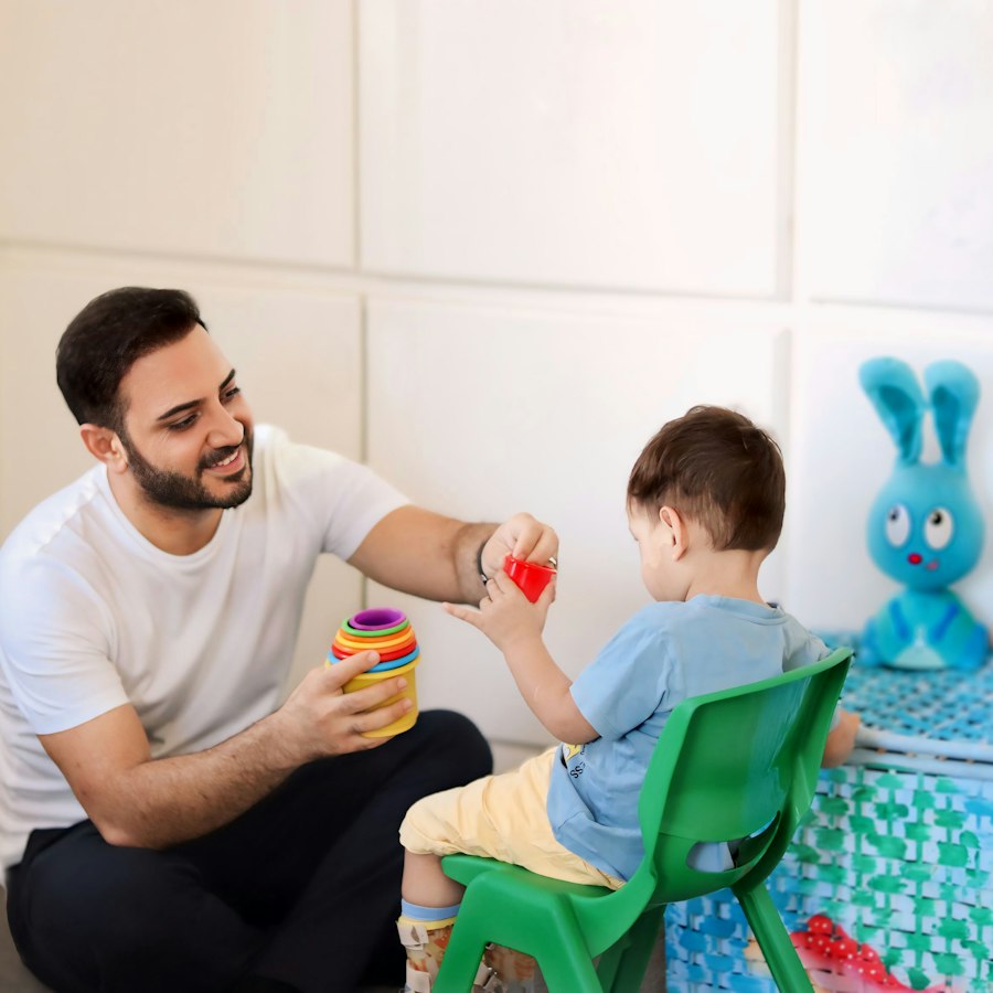 A therapist guiding a child through a speech therapy exercise