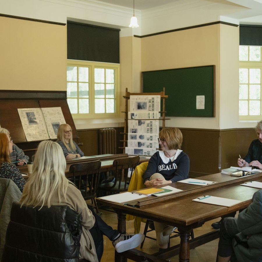 A facilitator leading a skill-building workshop for parents
